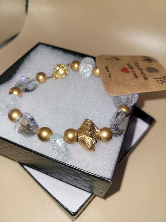 Hand crafted 7.0 in clear and gold colored bracelet
