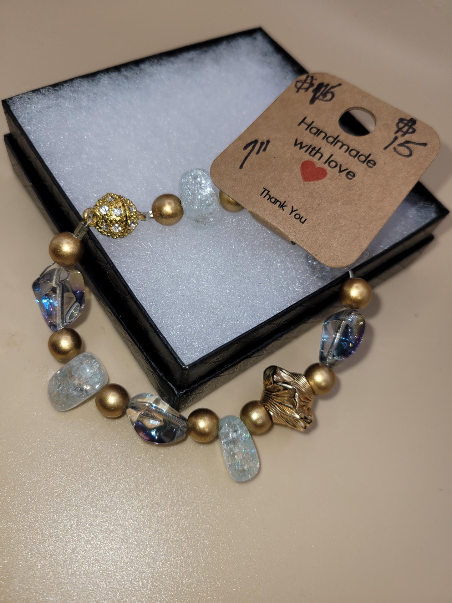 Hand crafted 7.0 in clear and gold colored bracelet